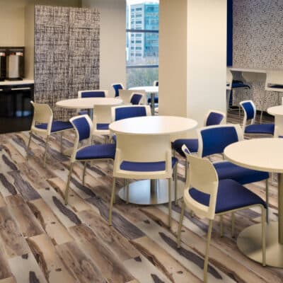 spacious hospital cafeteria with brown and tan commercial flooring